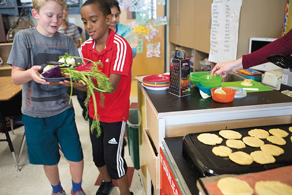 Fifth graders at Cragmont Elementary School in Berkeley used the Charlie Cart to make hand-pressed tortillas and curtido, a salad made from cabbage, carrot, and cilantro.