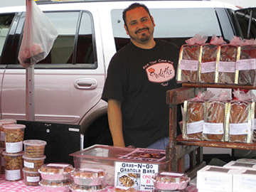Memo Garcia offers baked goods from Edith's in Modesto.