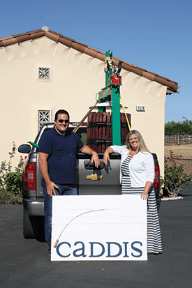 Just back from their honeymoon in July, Chris Sorensen and Courtney Garcia of Caddis Winery were back at work, moving a press bought from Larry Dino into the rented garage on Cedar Mountain Road. (Chris’s mother made the sign.)