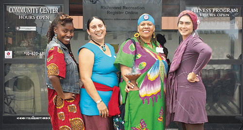 Ladies first: Pictured here at the Women’s Healing Collective event in Richmond are (from left) organizers Samyiah Franklin and Carla Perez, and volunteers Sharon Lungo and Peregrine Whitehurst.  Photo by Jillian Laurel Steinberger
